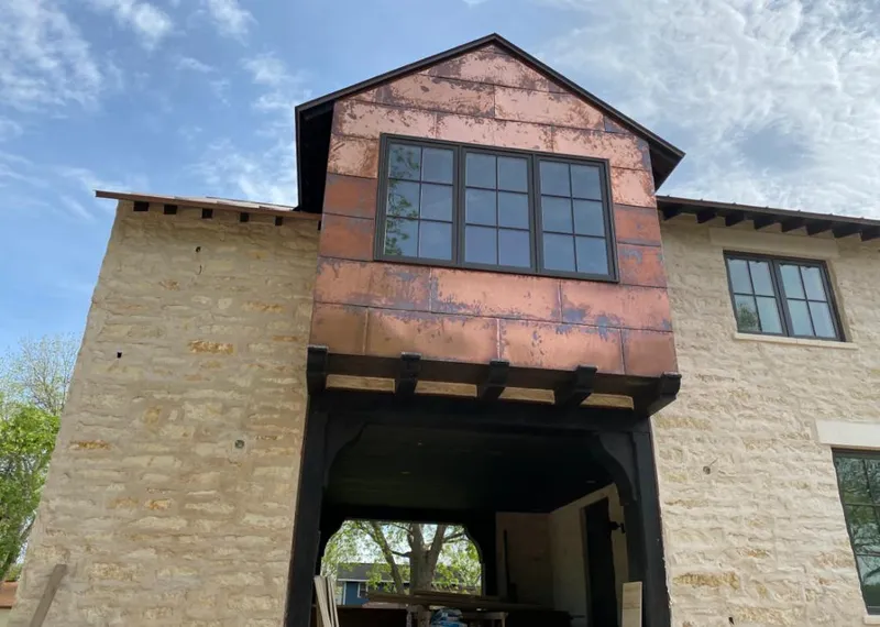 Copper metal panel facade on a stone building for Roof Repair in Martinez